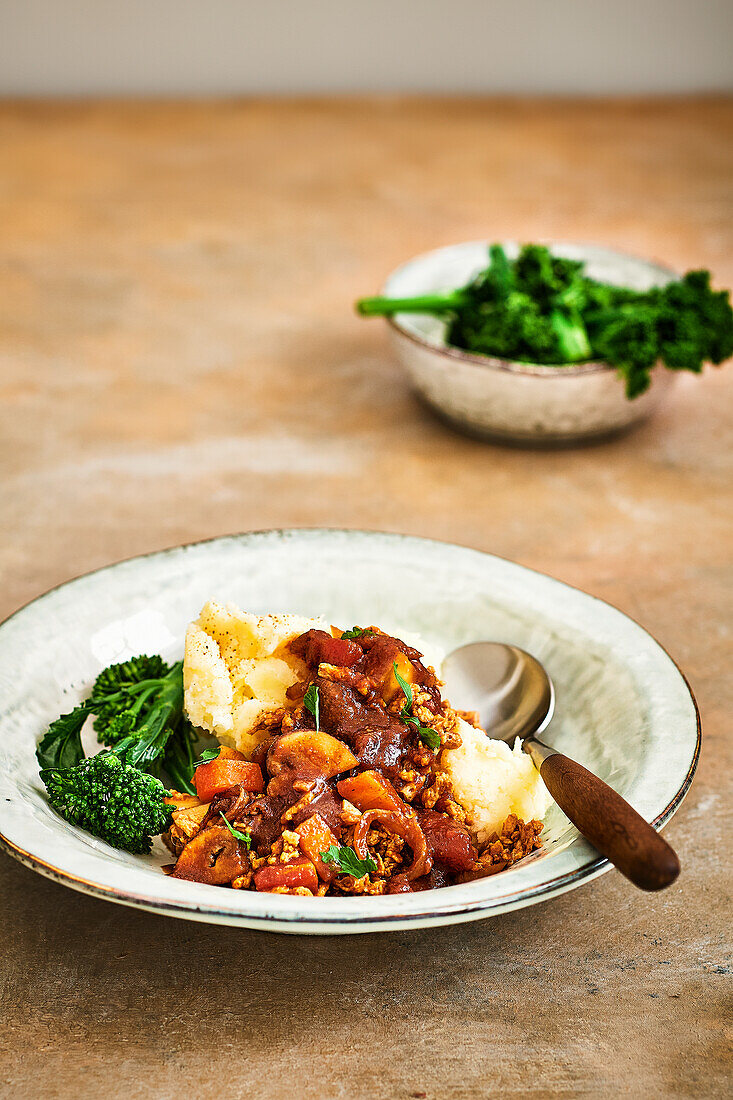 Vegetarian goulash with mashed potatoes and broccolini