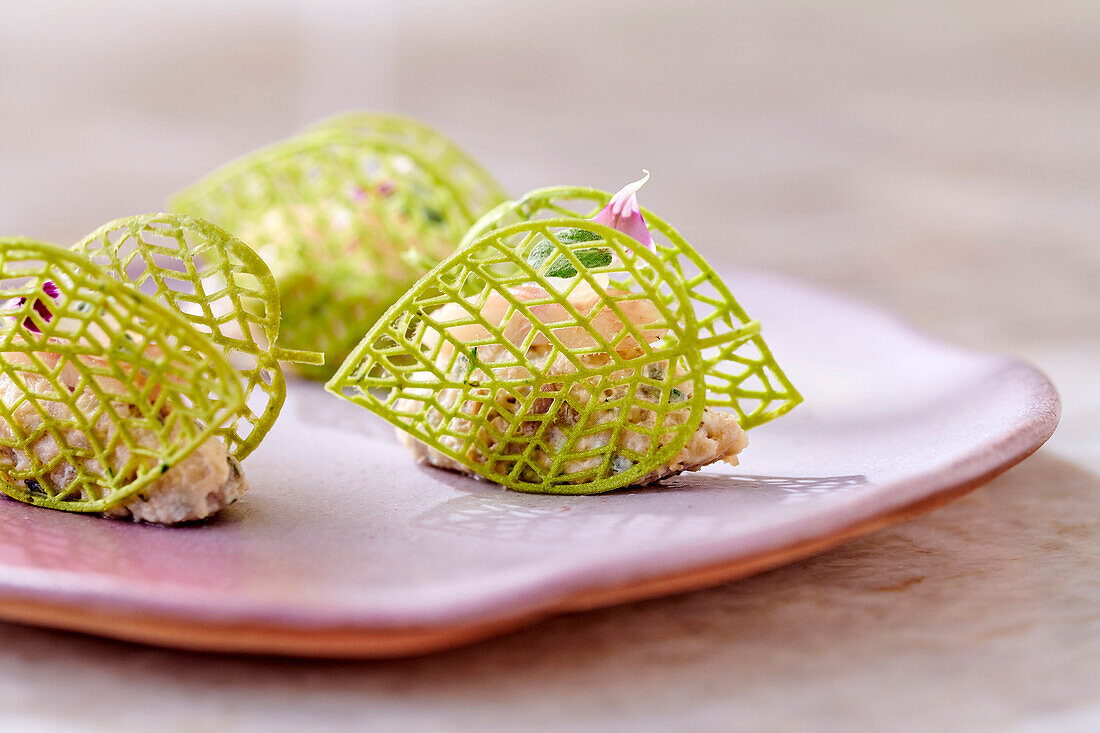 Amuse bouche with smoked eel and lime waffles