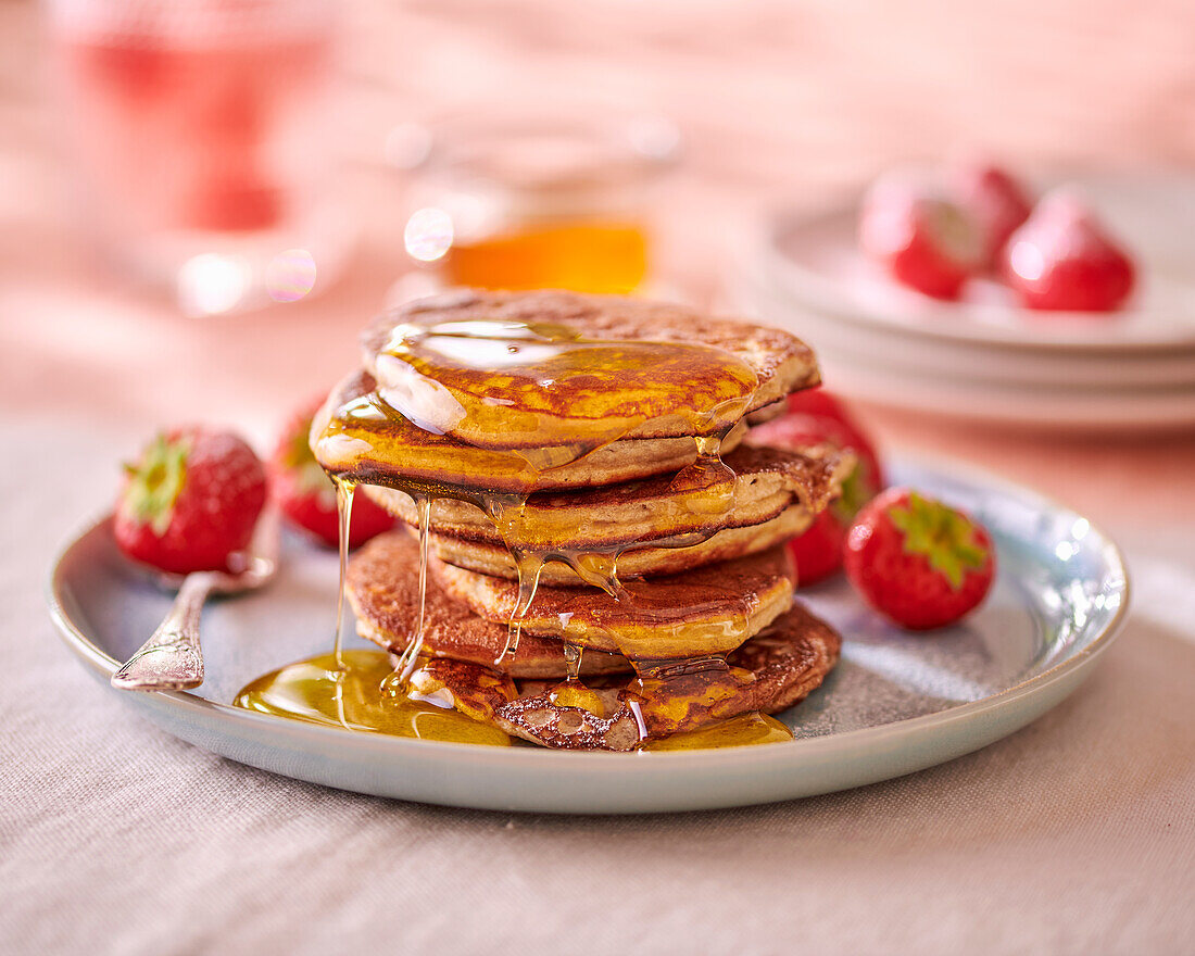 Banana and almond pancakes with maple syrup