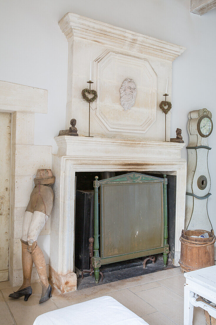 Country-style fireplace with antique decorations