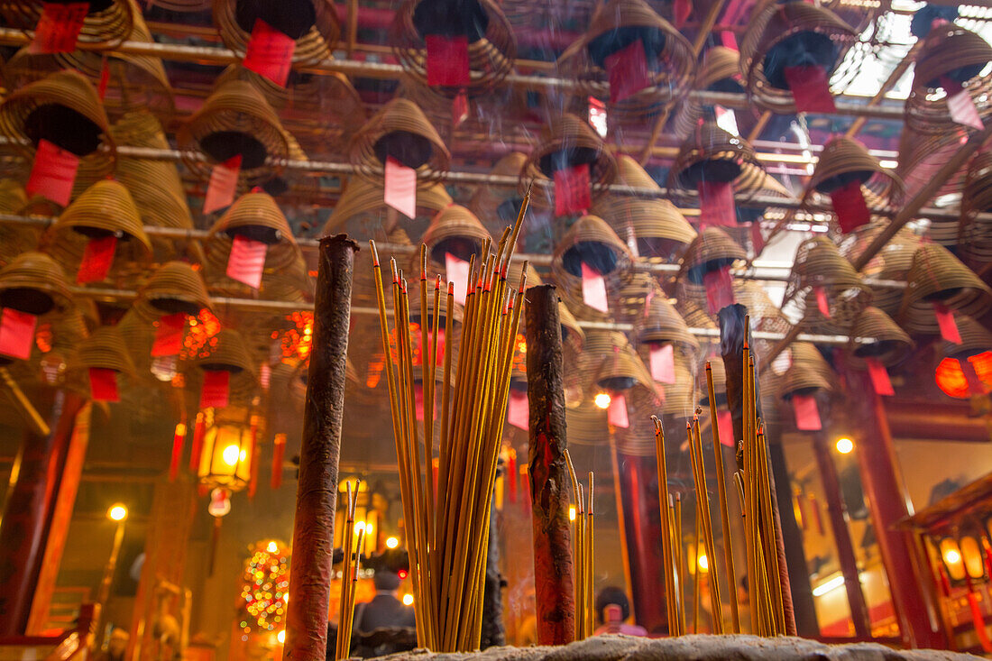 Burning incense sends prayers to heaven in the Man Mo Temple, a Buddhist temple in Hong Kong, China.