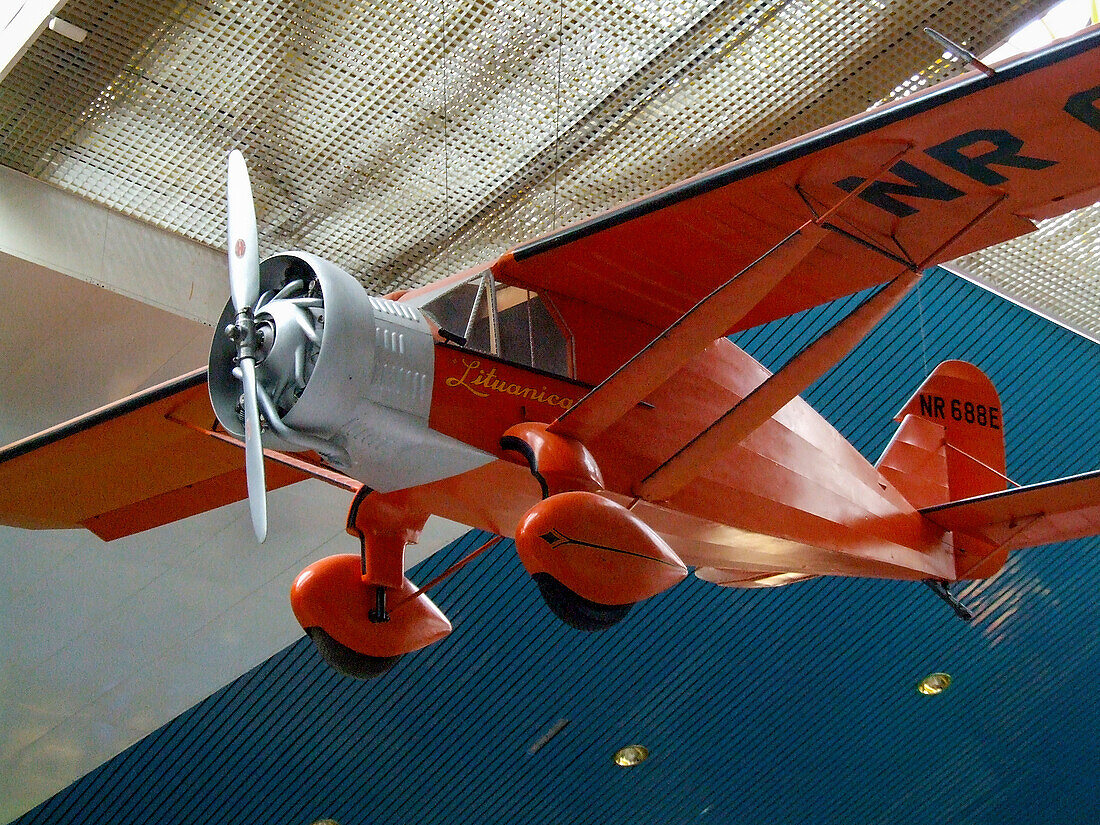 A reproduction of the 'Lituanica' hanging from the ceiling of the older Vilnius International Airport terminal in Lithuania. The Lituanica was a Bellanca CH-300 flown non-stop across the Atlantic from the United States to Europe in 1933 by two LIthuanian pilots.