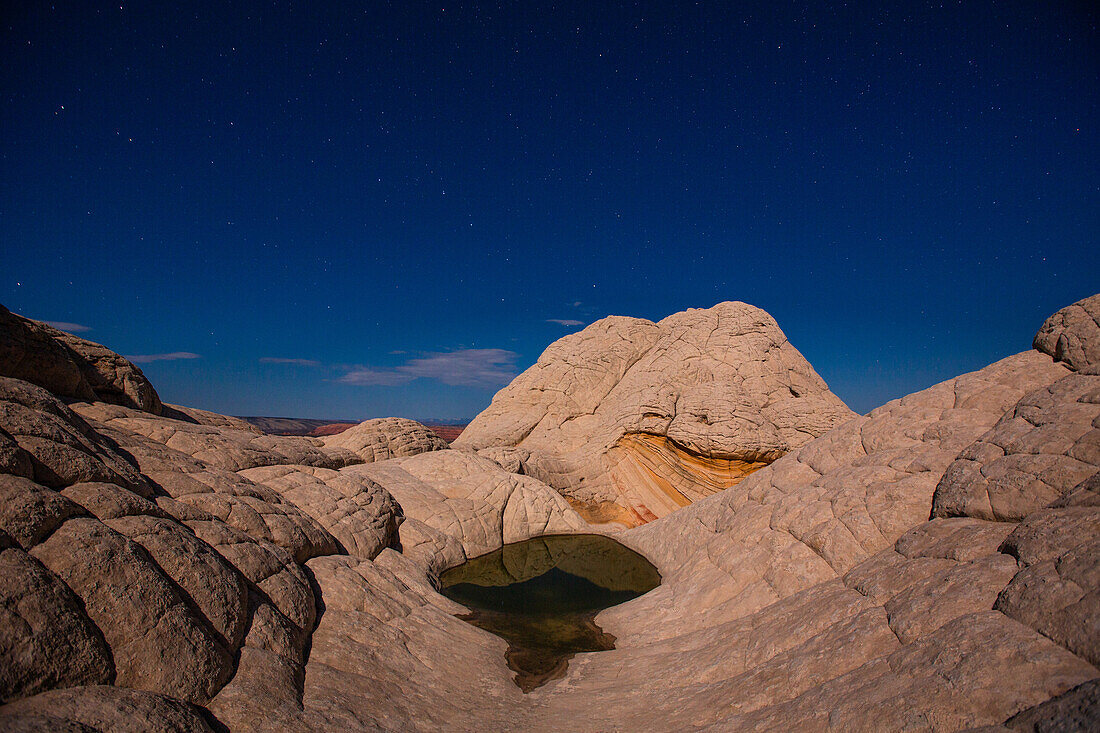 Stars over the moonlit sandstone in the White Pocket Recreation Area, Vermilion Cliffs National Monument, Arizona.