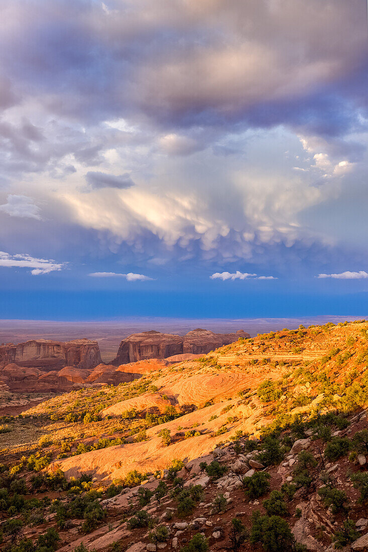 Last light on Monument Valley from Hunt's Mesa in the Monument Navajo Valley Tribal Park in Arizona. Mammatus clouds overhead.