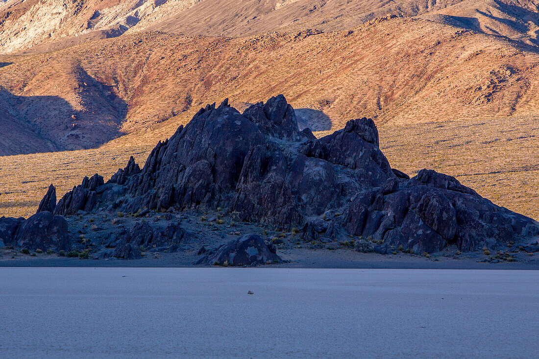 The Grandstand, a quartz monzonite island in the Racetrack Playa in Death Valley National Park in the Mojave Desert, California.