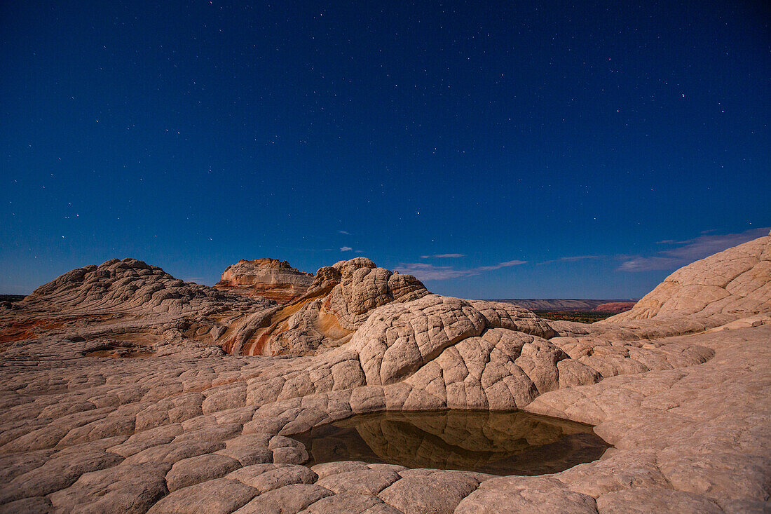 Stars over the moonlit sandstone in the White Pocket Recreation Area, Vermilion Cliffs National Monument, Arizona.