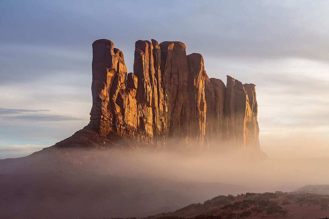 Camel Rockin the fog as seen from John Ford Point in the Monument Valley Navajo Tribal Park on the Navajo Reservation in Arizona.