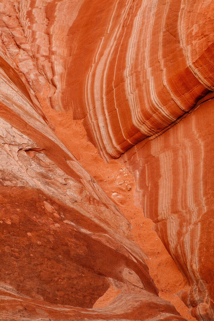 Eroded Navajo sandstone formations in the White Pocket Recreation Area, Vermilion Cliffs National Monument, Arizona. Small laterally displaced faults are evident in the stripes.