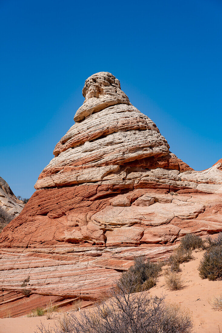 A teepee-shaped sandstone rock formation in the White Pocket Recreation Area, Vermilion Cliffs National Monument, Arizona.