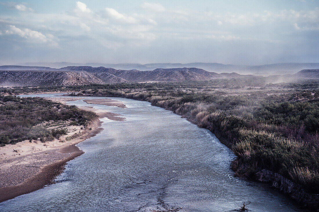 A wind storm blows over the Rio Grande River in Big Bend National Park in Texas. Mexico is at right.