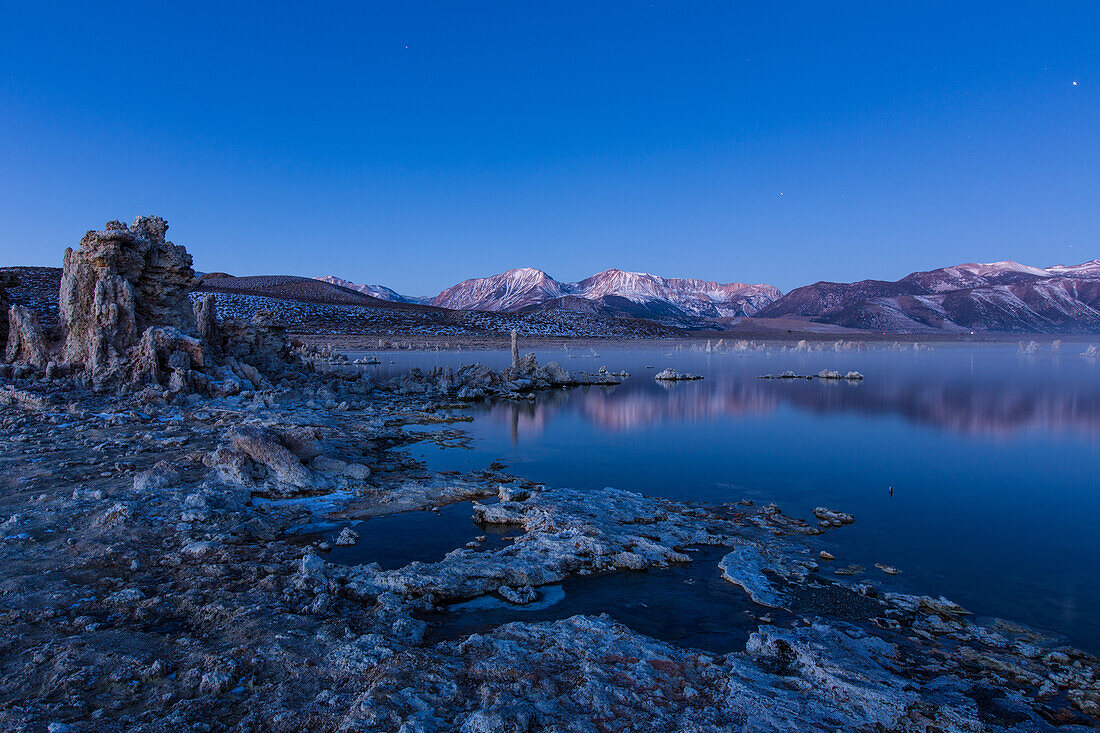 Predawn fog over the tufa formations on Mono Lake in California.