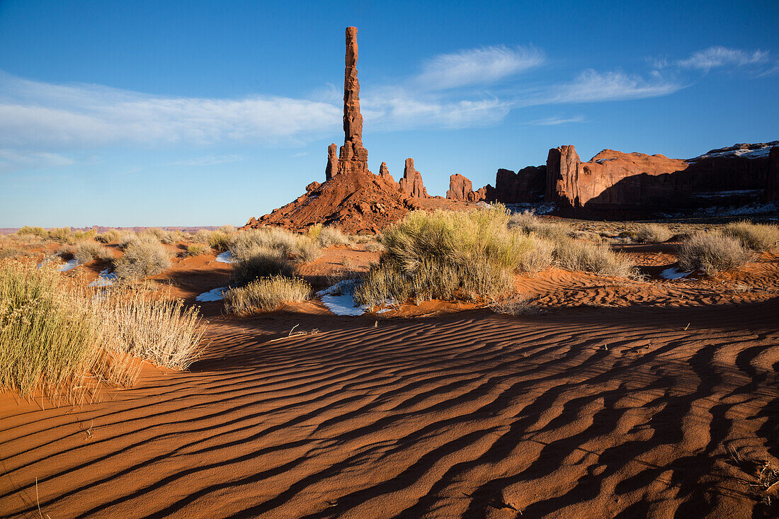 The Totem Pole with rippled sand in the Monument Valley Navajo Tribal Park in Arizona.