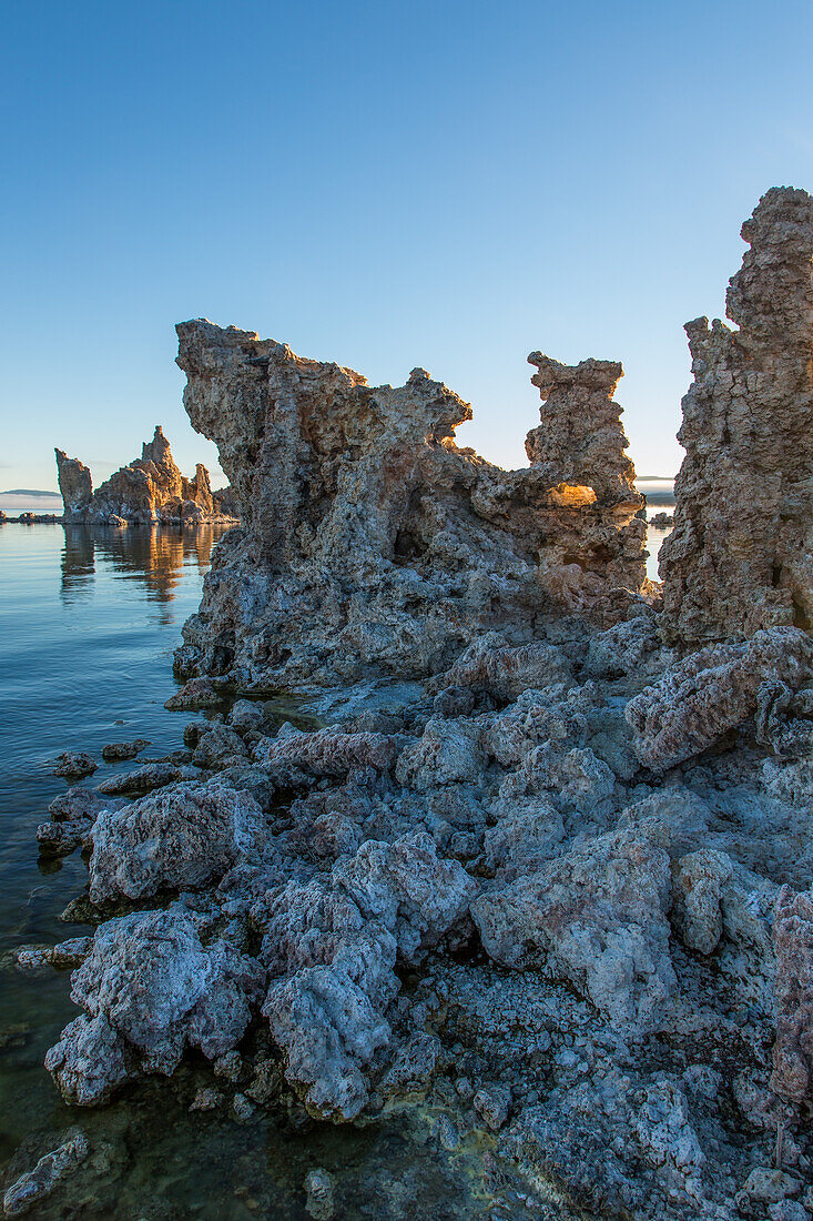 Tufa rock formations at sunrise in Mono Lake in California.