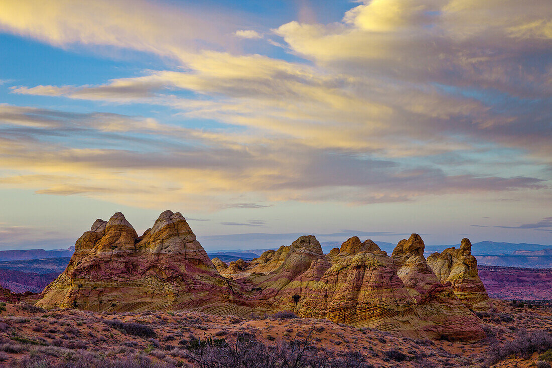 Post-sunset light on eroded Navajo sandstone formations in South Coyote Buttes, Vermilion Cliffs National Monument, Arizona.