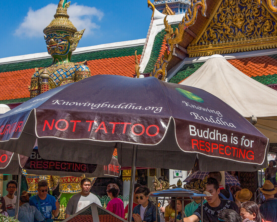 An umbrella with a message by the Chao Mae Kuan Im shrine at the Grand Palace complex in Bangkok, Thailand.