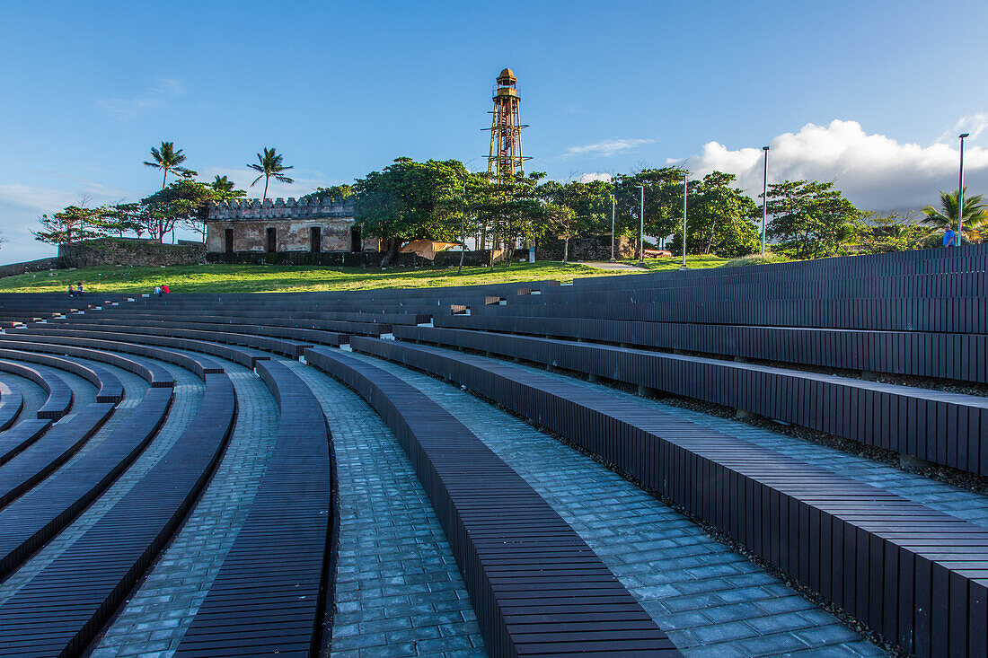 The cast-iron Puerto Plata lighthouse was erected in 1879 in what is now La Puntilla Park in Puerto Plata, Dominican Republic. It is 24.38 meters tall. A performance amphitheater in the park is in the foreground.