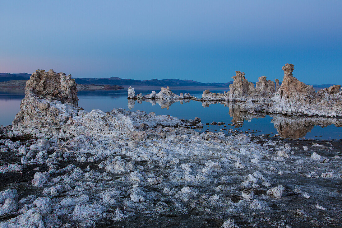 Tufa formations in Mono Lake in California in evening twilight.