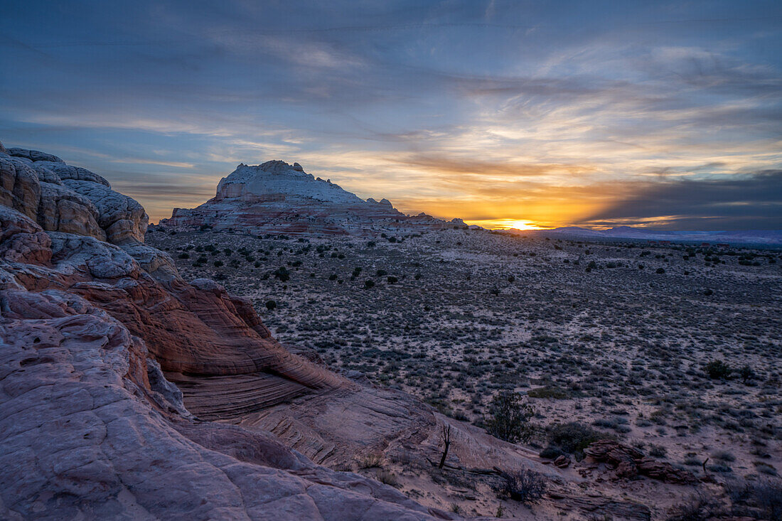 Sunset by the sandstone monolith in the White Pocket Recreation Area, Vermilion Cliffs National Monument, Arizona.