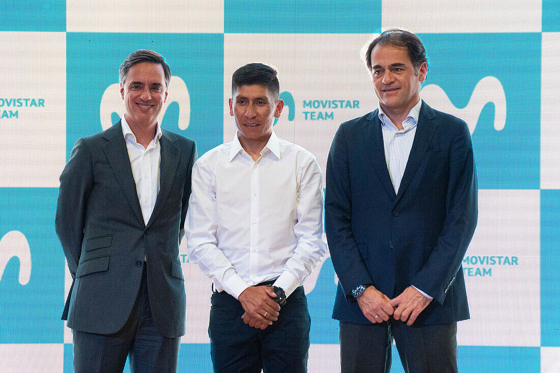 Alfonso Gomez the CEO of Telefonica Hispam (L), cyclist Nairo Quintana (C) and Fabian Hernandez CEO of Movistar Colombia (R), pose for a photo during a press conference announcing it's return to the Movistar Cycling team, in Bogota, Colombia on october 30, 2023.
