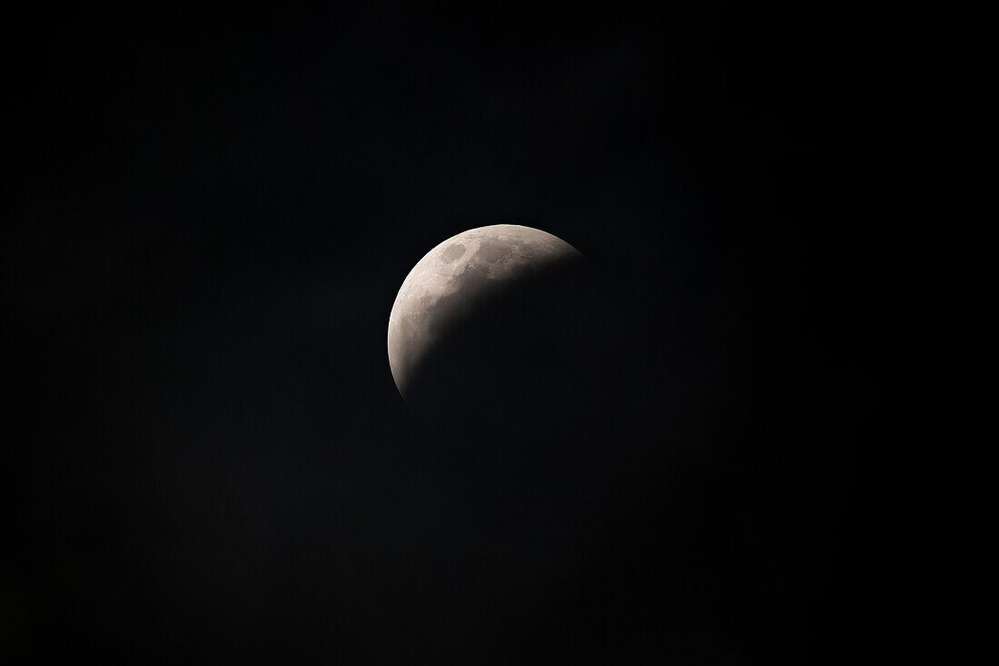 Total eclipse in progress of the super blood wolf moon on 21 January 2019, as viewed from Uxmal, Yucatan, Mexico.