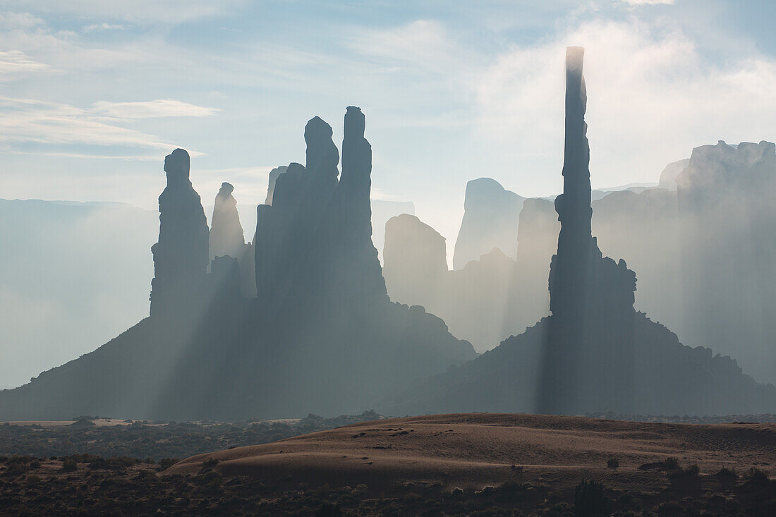 Telephoto view of the Totem Pole & the Yei Bi Chei in the Monument Valley Navajo Tribal Park in Arizona.