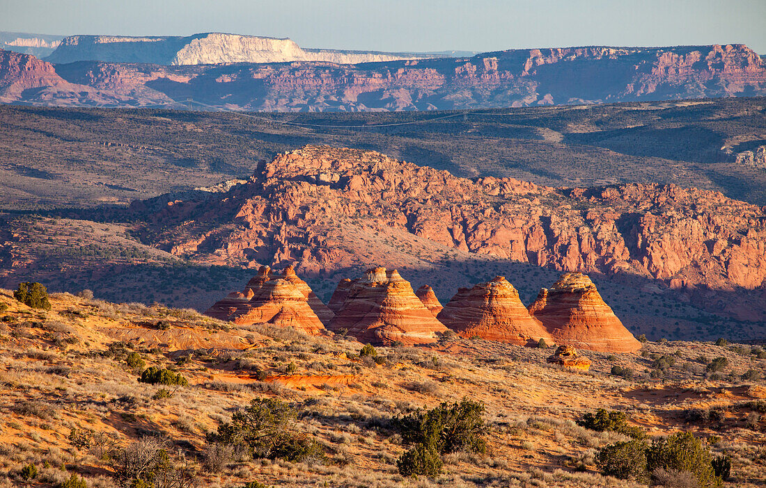 Sunrise light on the South Teepees, Navajo sandstone formations in North Coyote Buttes, Vermilion Cliffs National Monument, Arizona.