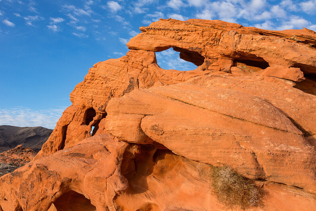 Unnamed natural arches in the eroded Aztec sandstone of Valley of Fire State Park in Nevada.