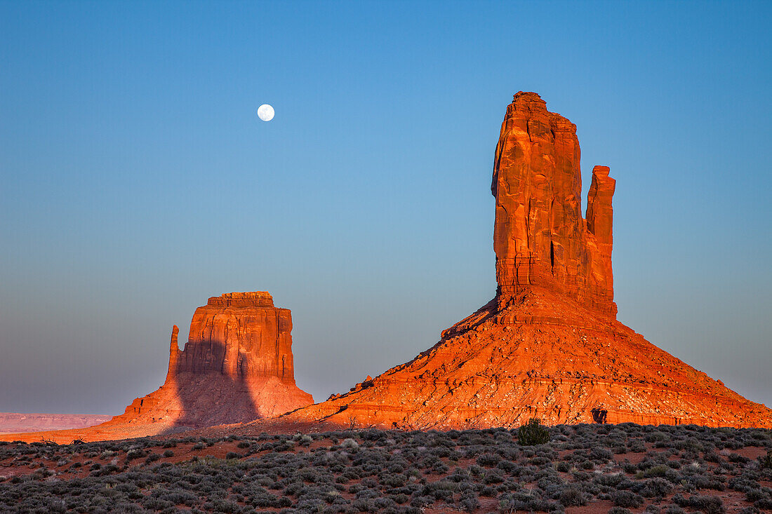 Shadow of the West Mitten projected onto the East Mitten at sunset in the Monument Valley Navajo Tribal Park in Arizona. This phenomenon occurs twice per year.