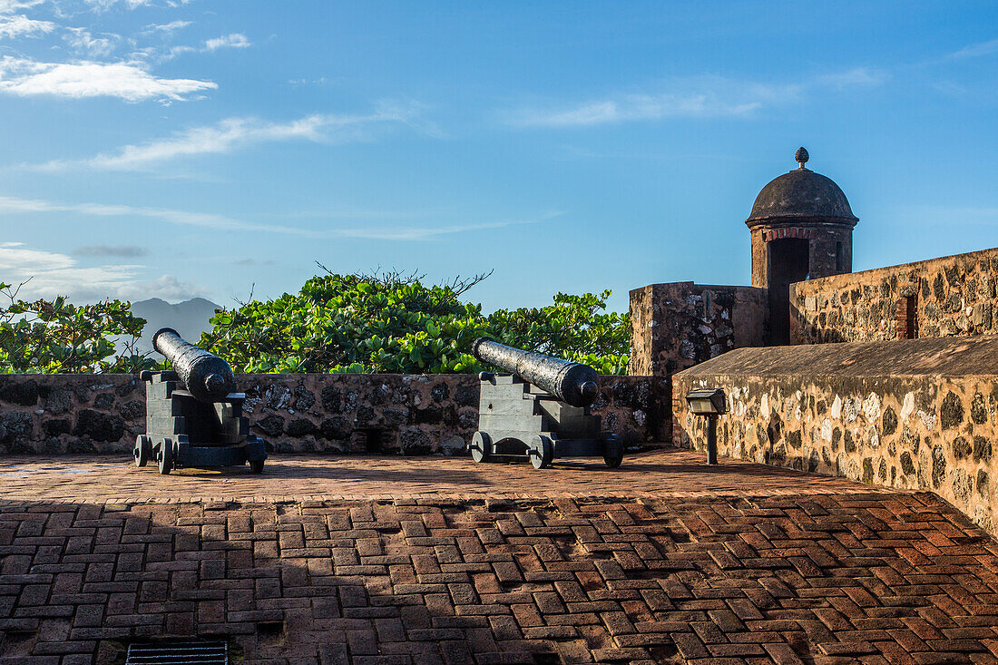 Colonial Spanish cannons by a guerite or sentry box at Fortaleza San Felipe, now a museum at Puerto Plata, Dominican Republic.