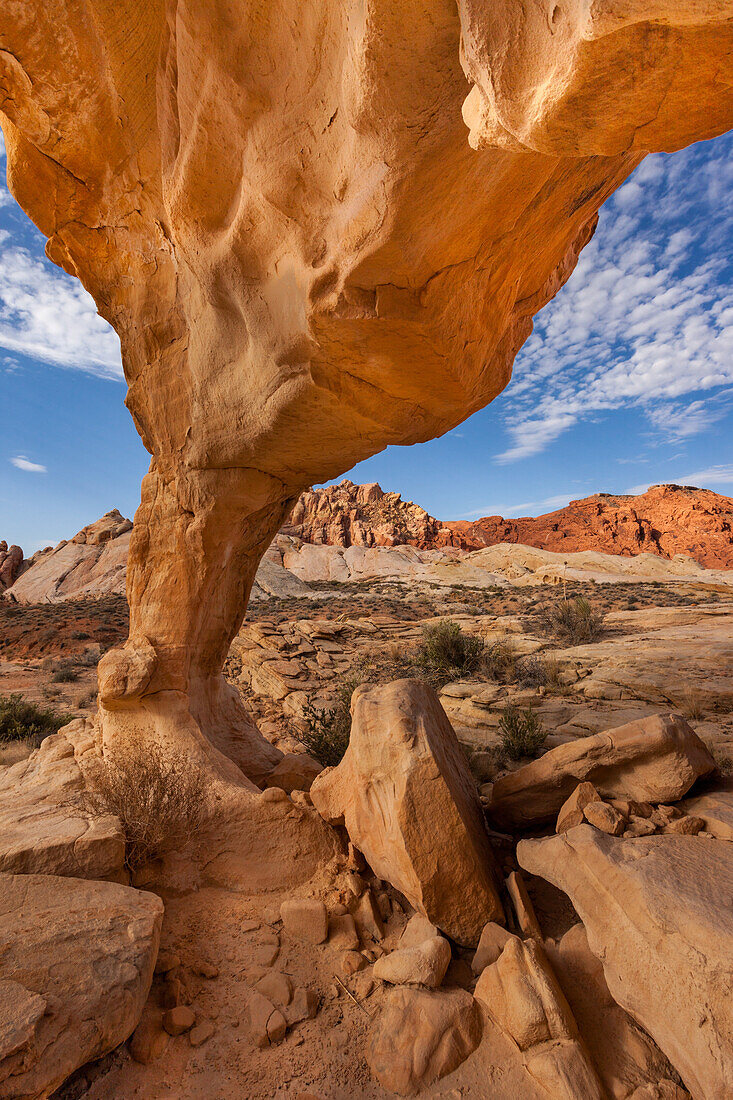 An unnamed natural arch in the eroded Aztec sandstone of Valley of Fire State Park in Nevada.