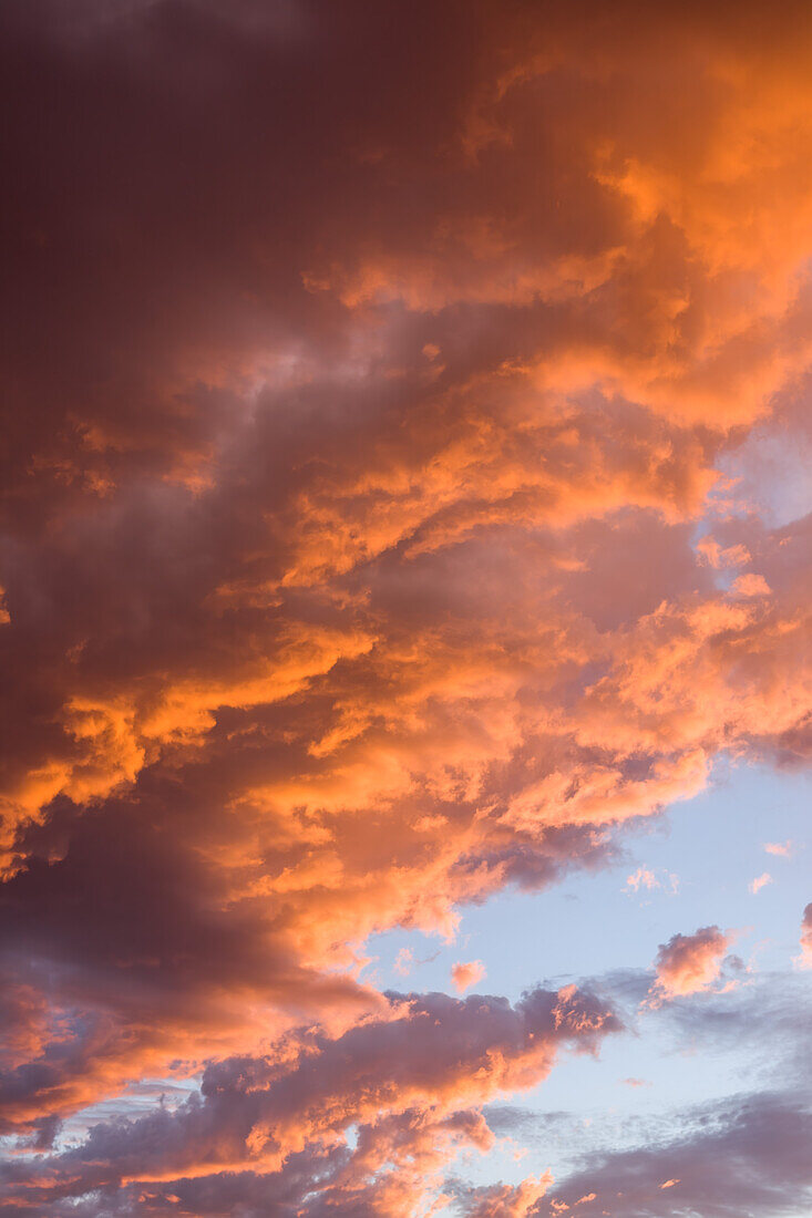 Colorful cumulus clouds at sunset over the canyon country near Moab, Utah.