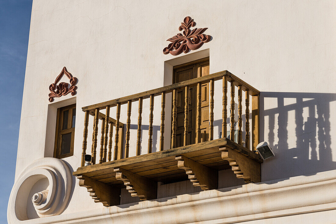 Detail of a wooden balcony and decorative designs on the Mission San Xavier del Bac, Tucson Arizona.