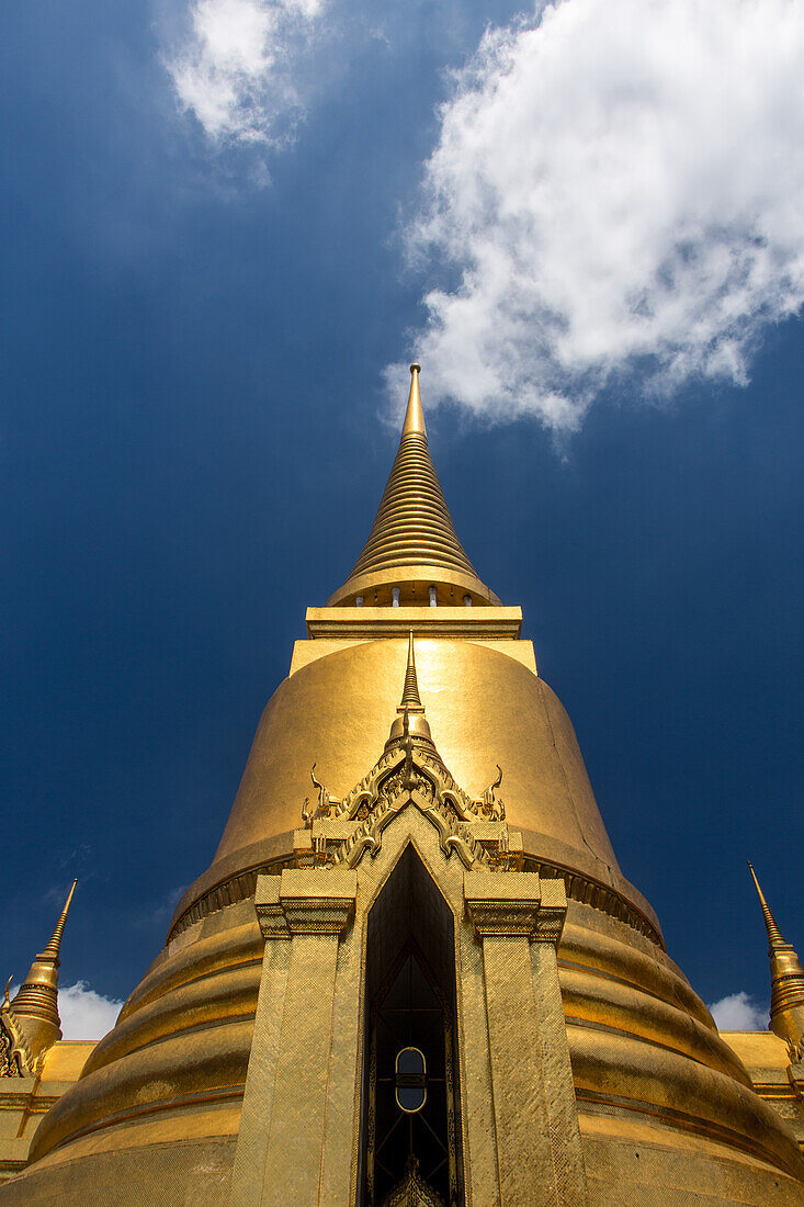 The golden Phra Sri Ratana Chedi by the Temple of the Emerald Buddha at the Grand Palace complex in Bangkok, Thailand.
