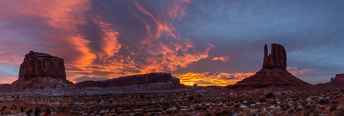 Photographers shooting sunset skies over Monument Valley in the Monument Valley Navajo Tribal Park in Arizona.