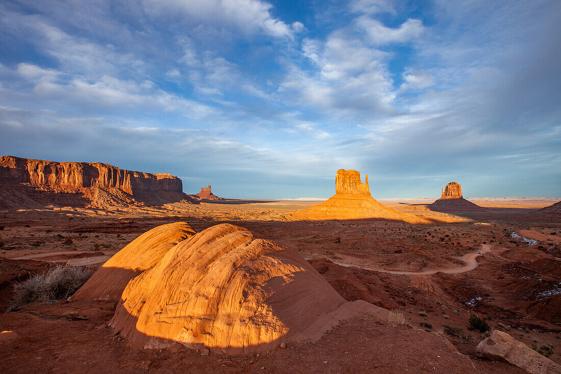 The boulders in front of the Mittens in the Monument Valley Navajo Tribal Park in Arizona. Sentinal Mesa is a left.