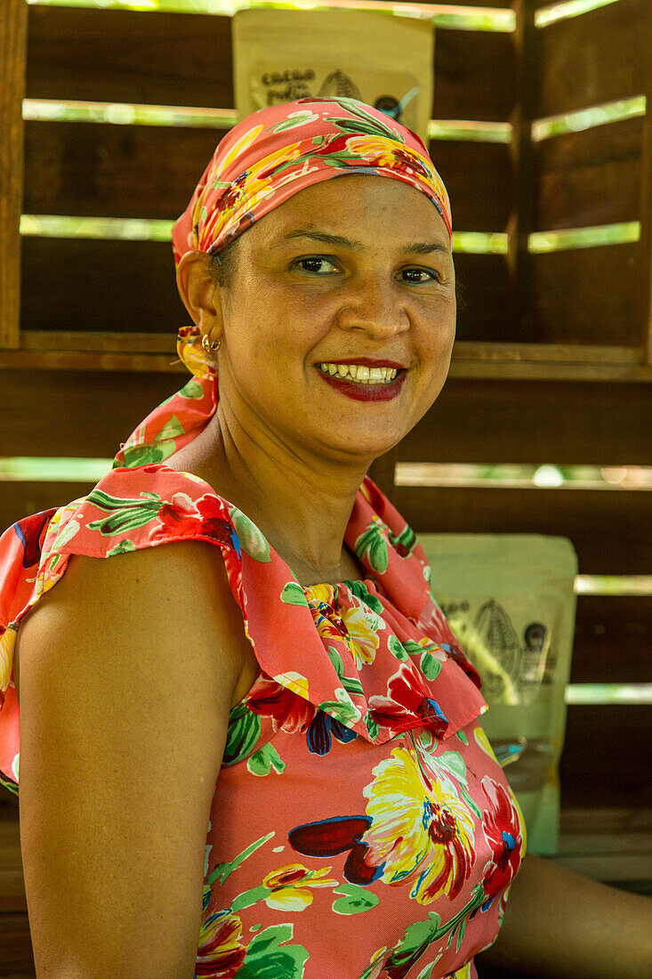 A Dominican woman worker on a cacao plantation tour. Dominican Republic.
