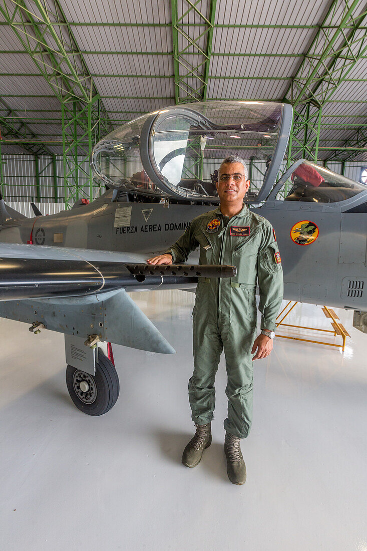 A Dominican Air Force pilot by the gun on a Super Tucano fighter aircraft at the San Isidro Air Base in the Dominican Republic.