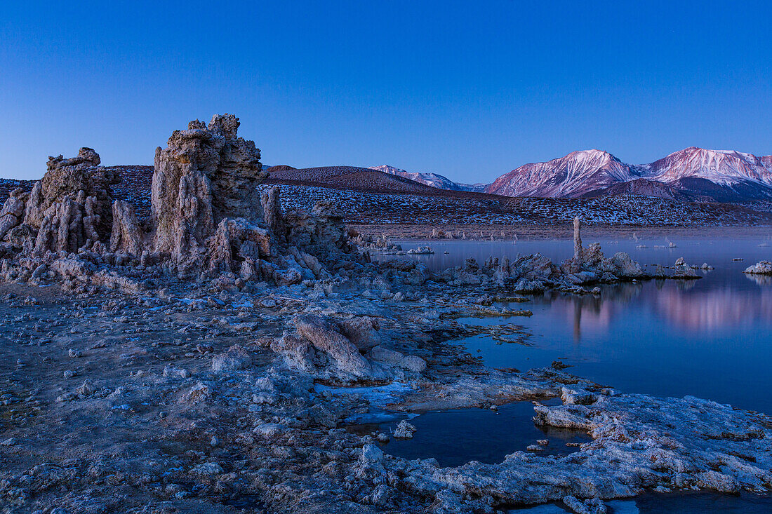 Predawn view of the tufa formations on Mono Lake in California. The Eastern Sierra Mountains are in the background.