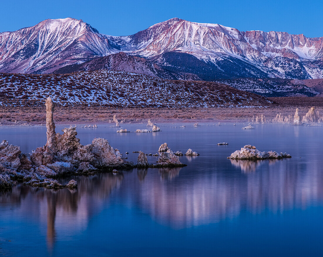 Predawn view of the tufa formations on Mono Lake in California. The Eastern Sierra Mountains are in the background.
