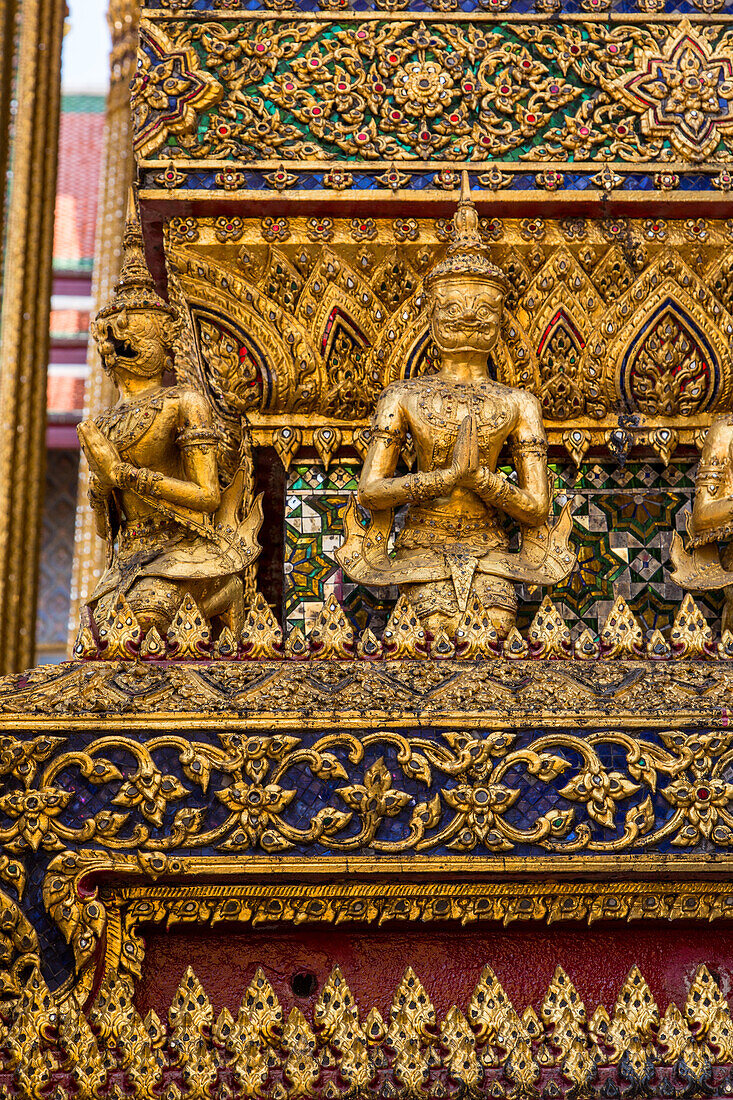 Small yaksha guardian statues on the Phra Mondhop in the Grand Palace complex in Bangkok, Thailand. A yaksha or yak is a guardian spirit in Thai lore.