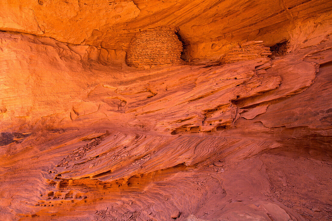 An Ancestral Puebloan ruin inside Honeymoon Arch in Mystery Valley in the Monument Valley Navajo Tribal Park in Arizona.