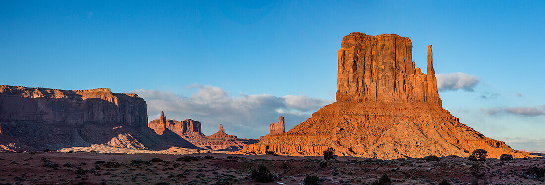 Sentinal Mesa, the Utah monuments and the West Mitten in the Monument Valley Navajo Tribal Park in Arizona.