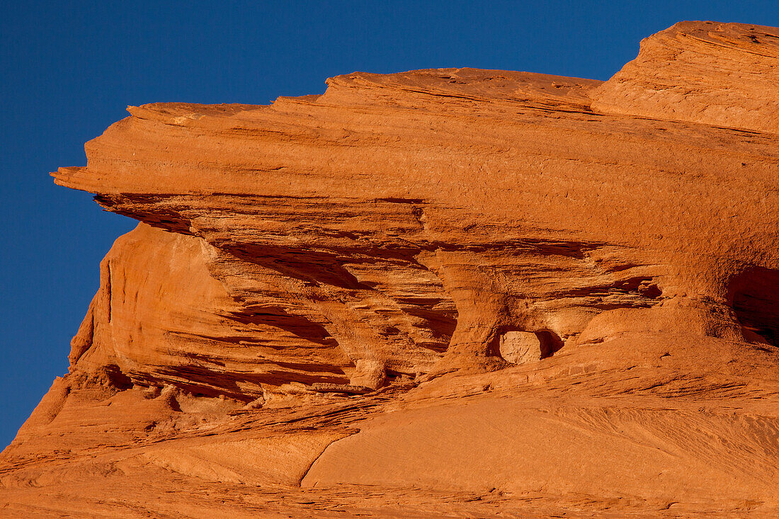 A small micro arch in the eroded sandstone in Mystery Valley in the Monument Valley Navajo Tribal Park in Arizona.