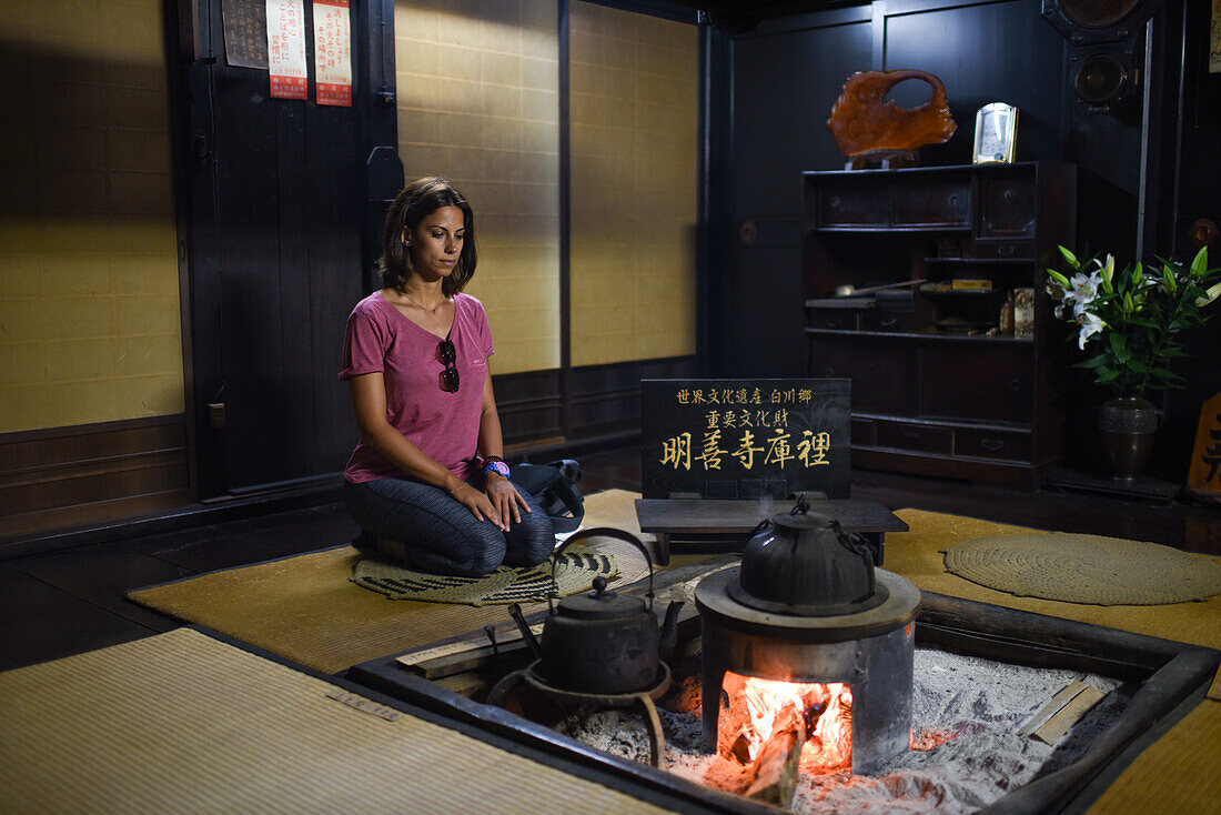 Young caucasian woman inside a traditional house.
