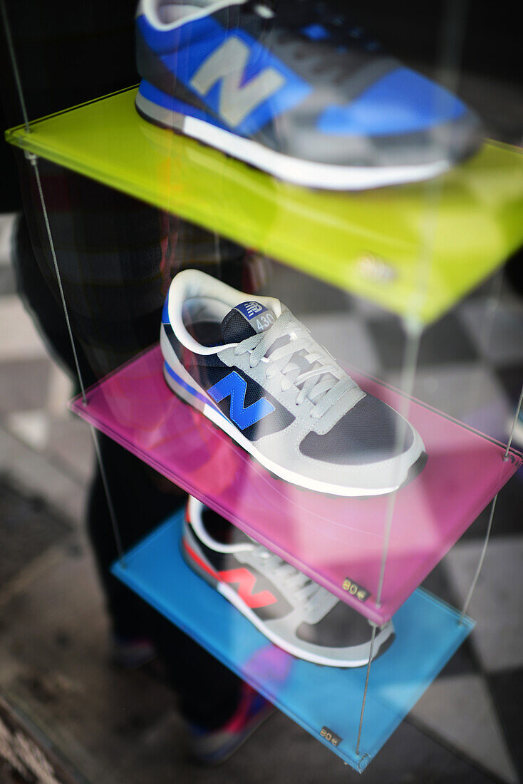 Sneakers in store display window, Granada, Spain