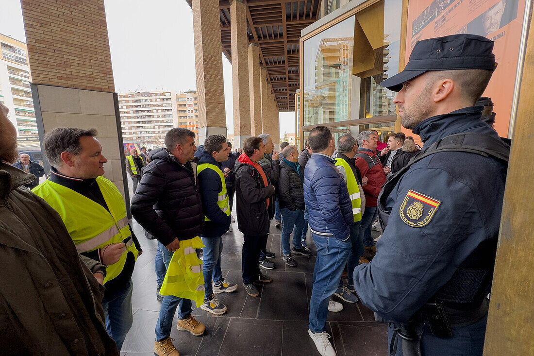 Agricultural organizations and groups of farmers join forces to show their demand at the National Meeting of Cereal Operators held within the framework of the FIMA. A small group of farmers protested this Thursday in front of the Zaragoza Auditorium, Spain