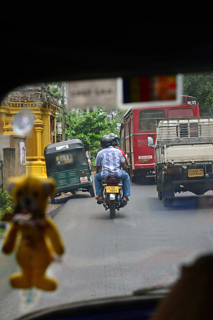 View of city road from inside tuk tuk, Sri Lanka