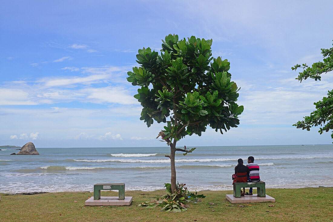 Young couple looking at the sea in Weligama, Sri Lanka