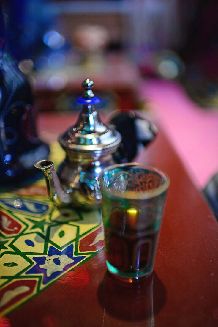 Tea glass and jar on table at tea house, Granada, Spain