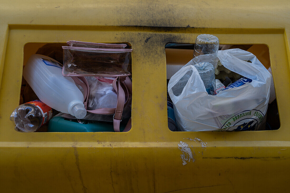 Bags with plastic in recycle bin